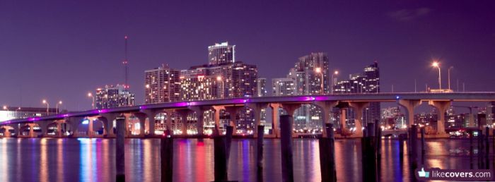 City night river bridge with purple lights