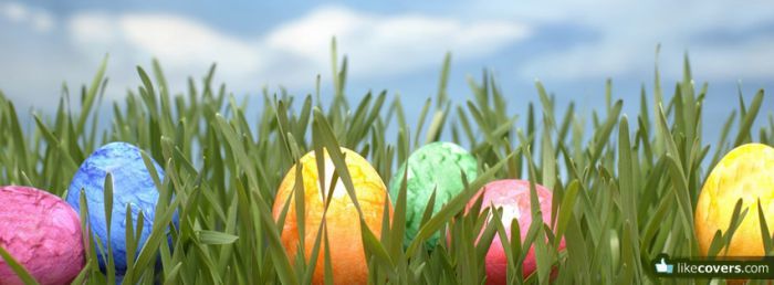 Colorful easter eggs in the grass blue sky and clouds