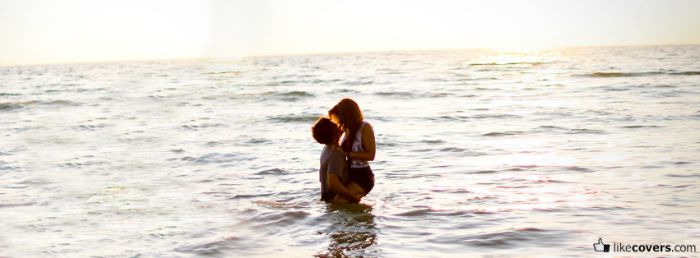 Couple kissing in the ocean