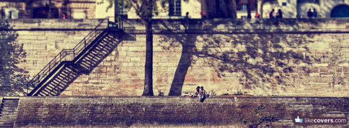 Couple kissing on a sidewalk Facebook Covers