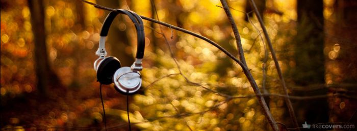 Headphones on a branch in the woods Facebook Covers