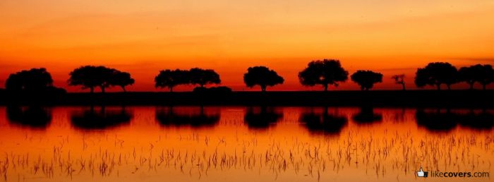 Orange Sky and Reflection of Trees in the Lake Facebook Covers