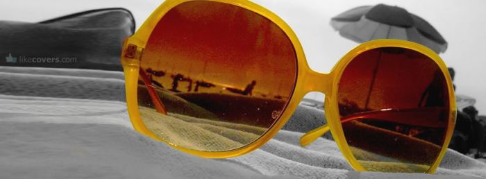 Orange Sunglasses on the beach Facebook Covers