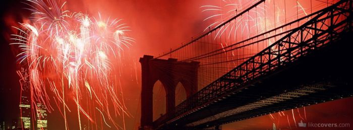 Red fireworks over a bridge